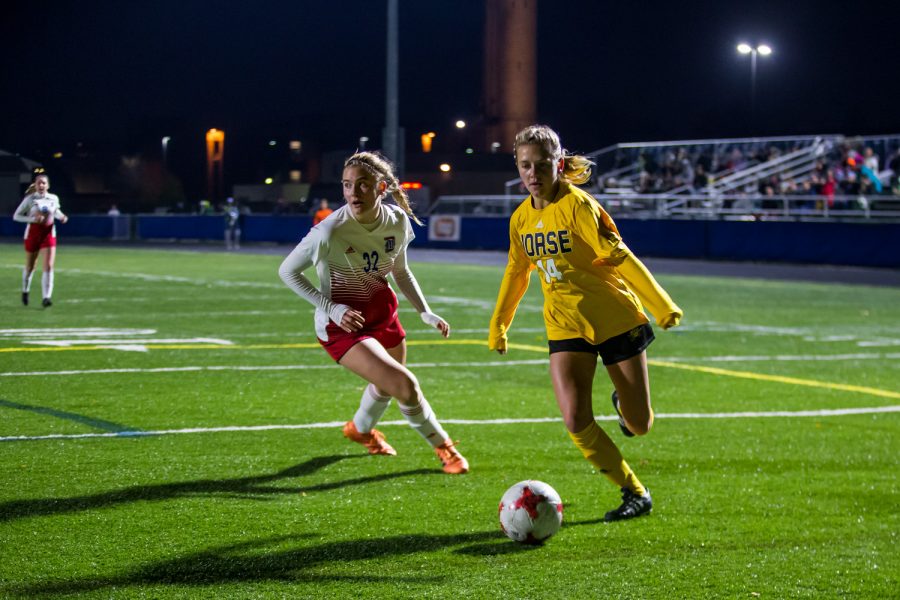 Lindsey Meyer (14) drives down the field during the game against Detroit Mercy in Detroit on Friday Night. The Norse Defeated Detroit Mercy 2-0 on the night.