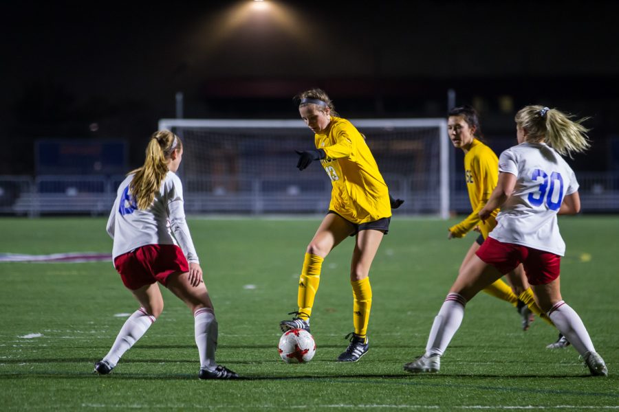 Shelby Wall (13) fights past Detroit defenders during the game against Detroit Mercy in Detroit on Friday Night. The Norse Defeated Detroit Mercy 2-0 on the night.