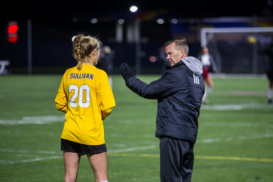Women's Soccer Head Coach Bob Sheehan Talks to Megan Sullivan (20) during halftime in the game against Detroit Mercy in Detroit on Friday Night. The Norse Defeated Detroit Mercy 2-0 on the night.
