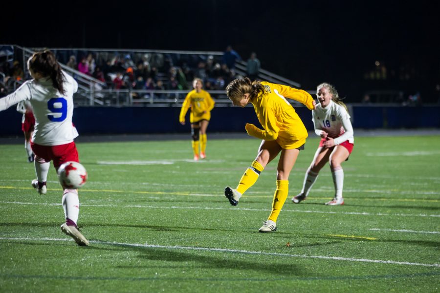 Shawna Zaken (8) shoots during the game against Detroit Mercy in Detroit on Friday Night. Zaken had 2 goals on the night.