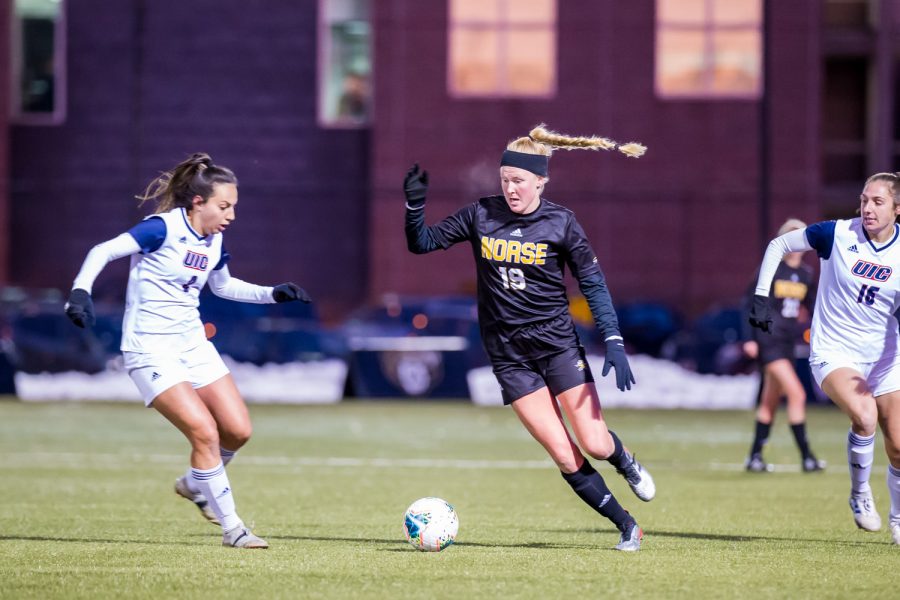 Chloe Mills (19) fights past a UIC defender during the semifinal game of the Horizon League Tournament against UIC. The Norse fell to UIC 1-0 in double overtime.