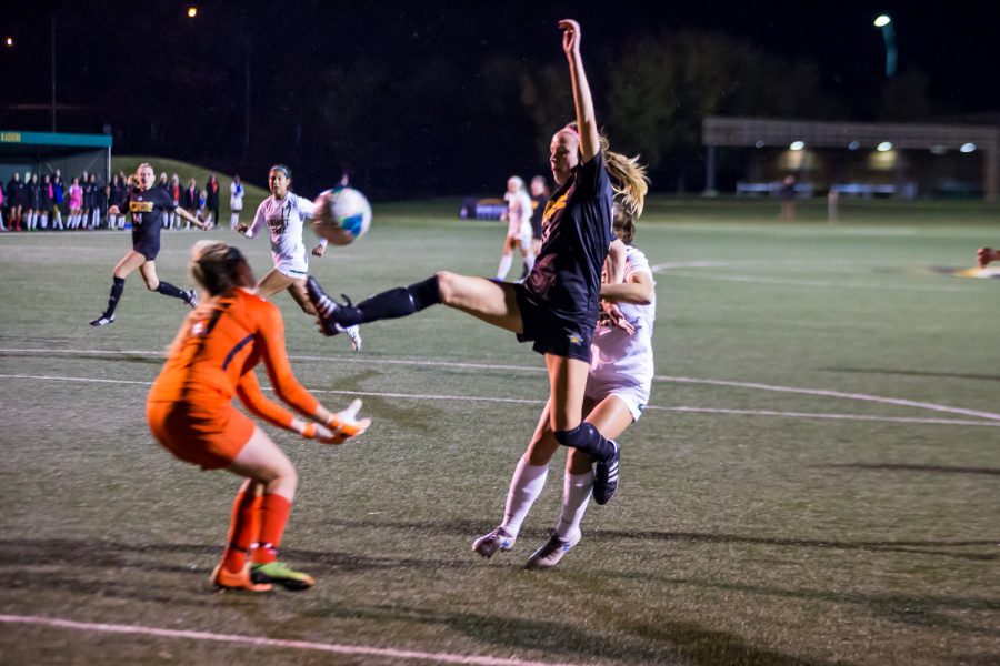 Shelby Wall (13) fights to score off of a ball in the air during the quarter final game of the Horizon League Tournament Against Wright State. The Norse defeated Wright State 3-1 and will advance to the Semi-Final game in Milwaukee.