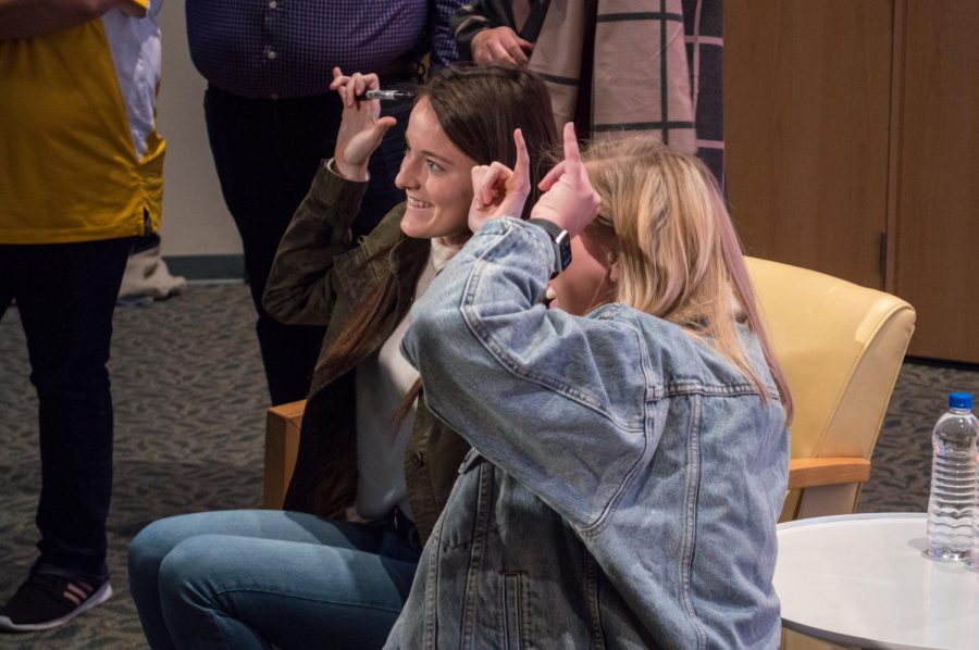 US Women's National Team midfielder Rose Lavelle Norse Ups with an NKU student after APB's keynote speaker event. 