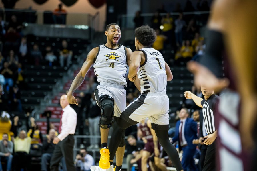 Adrian Nelson (4) celebrates with Adham Eleeda (1) after a timeout called by EKU. The Norse defeated EKU 76-57.