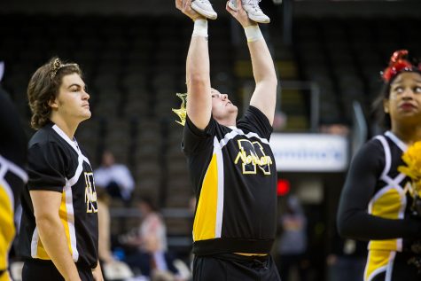 Zachary Stone throws a stunt during NKU womens basketball game.