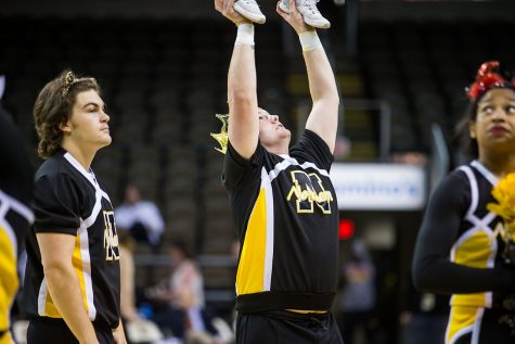 Zachary Stone throws a stunt during NKU womens basketball game.