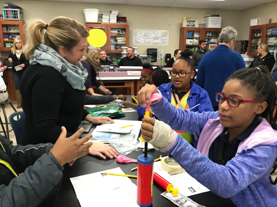 CINSAMs STEM Outreach Director Ella Bowling and school students.