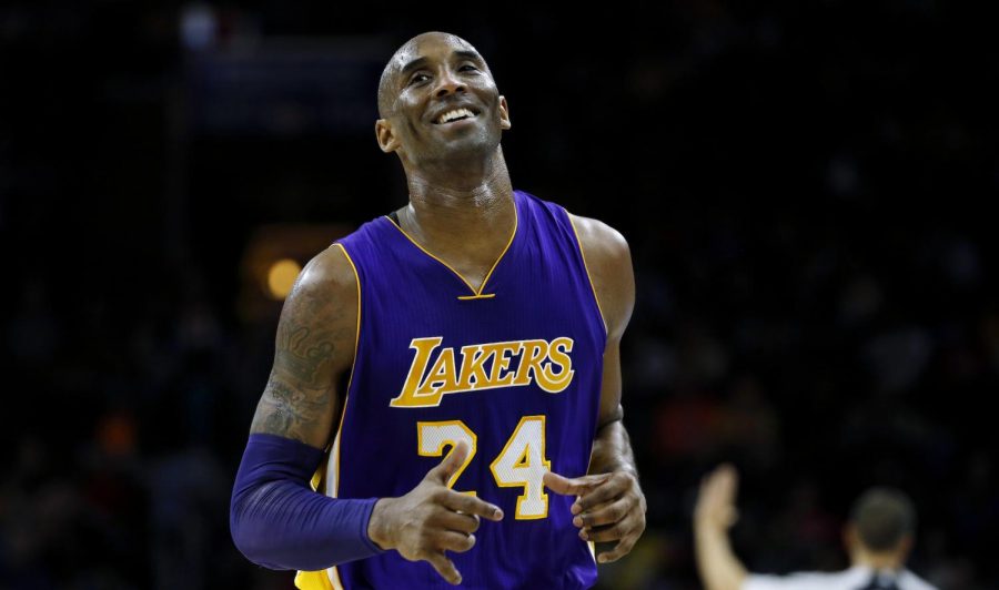 Los Angeles Lakers’ Kobe Bryant smiles as he jogs to the bench during the first half of an NBA basketball game against the Philadelphia 76ers, Tuesday, Dec. 1, 2015, in Philadelphia. AP Photo by Matt Slocum.