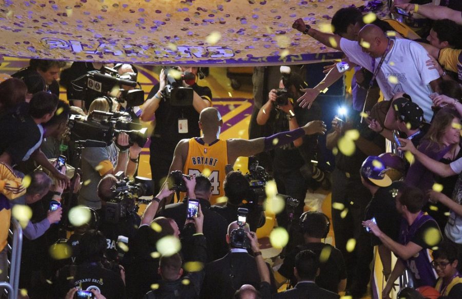 Los Angeles Lakers forward Kobe Bryant walks off the court after finishing his last NBA basketball game before retirement in Los Angeles on April 13, 2016. (AP Photo/Mark J. Terrill)