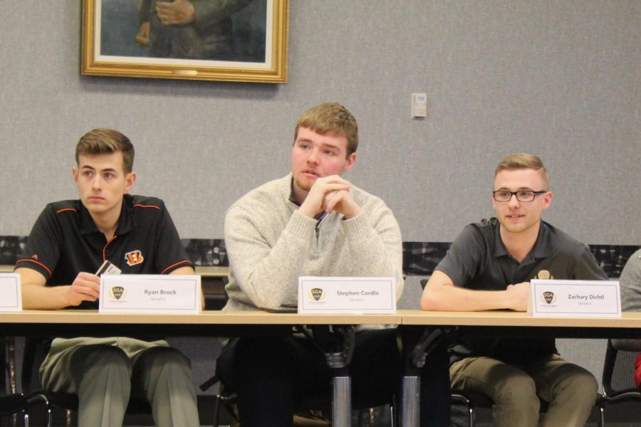 Senators Ryan Brock, Stephen Cordle and Zachary Dichtl listen to Sectary Archer pitches for All Card.