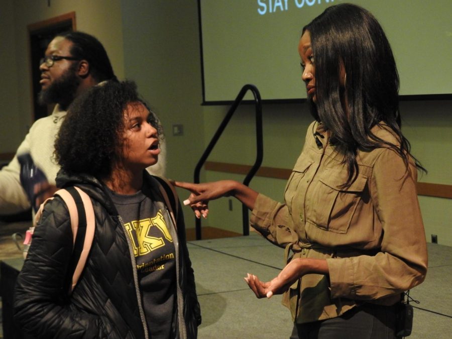 Deshauna Barber talks to a student after the event.