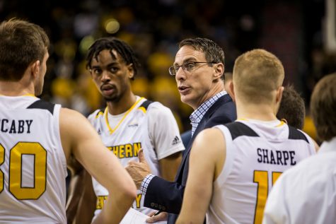 Mens Basketball Head Coach Darrin Horn talks to players during a timeout during the homecoming game against Detroit Mercy.  The Norse defeated Detroit 84-65 on Saturday night.