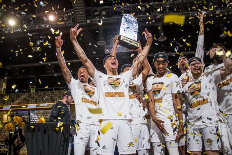 NKU players celebrate on stage moments after their 71-62 win over UIC. With the win the Norse secure a spot in the NCAA Tournament.