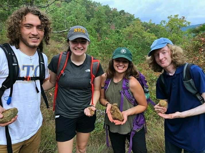 Senior geology major Cameron Peterson (far right) with friends in North Carolina.