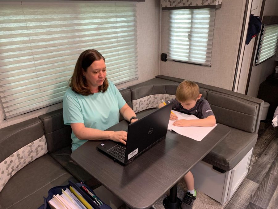 Dr.+Jacqueline+Emerine+and+her+son+working+in+their+converted+office+trailer.