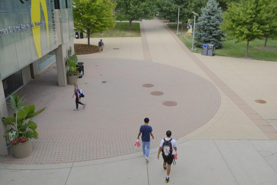 Students outside the SU on their first day back to campus. 