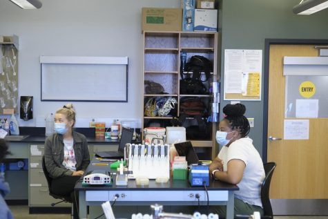 Genetics lab students go over lab etiquette with Assistant Professor Brian Carlson.