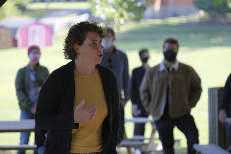 Amy McGrath stands in front of a small crowd and speaks.