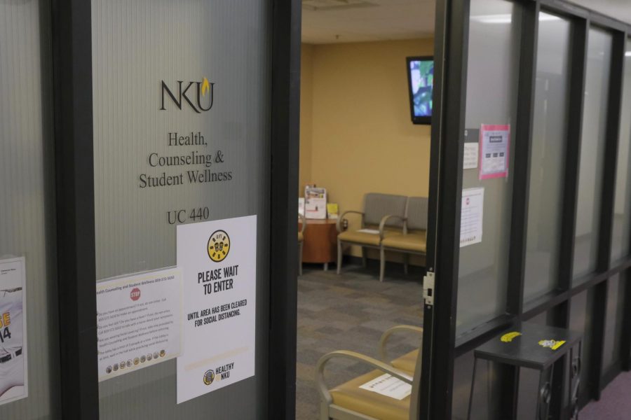 The entrance to Health, Counseling and Student Wellness in University Center. A frosted glass door.