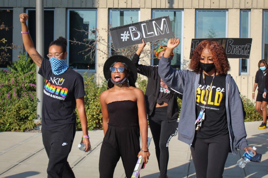 Anna Marie Adams (center) leads the protest next to Kiazja Watterson-Brown.