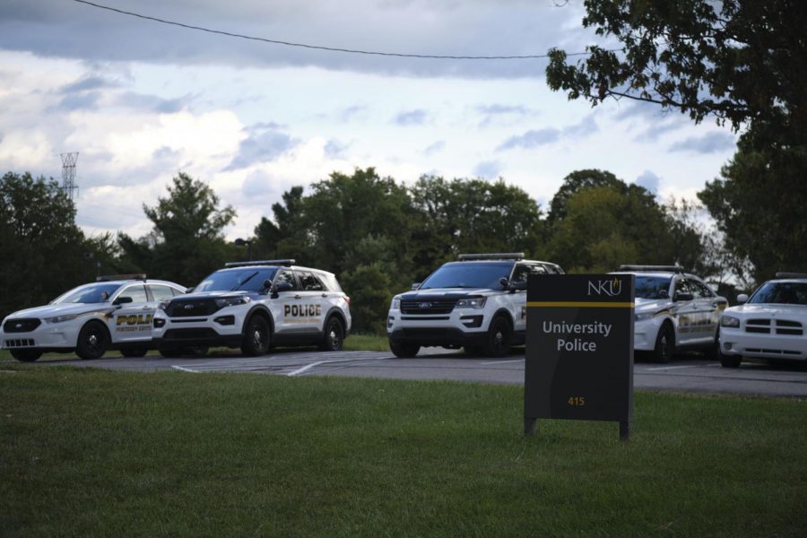 NKU University Police cruiser fleet lined up outside their building on campus.