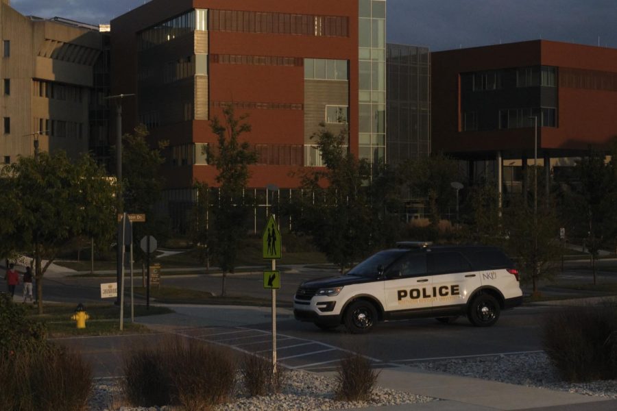 A NKU University Police officer on patrol on Kenton Drive in front of the Health Innovation Center.