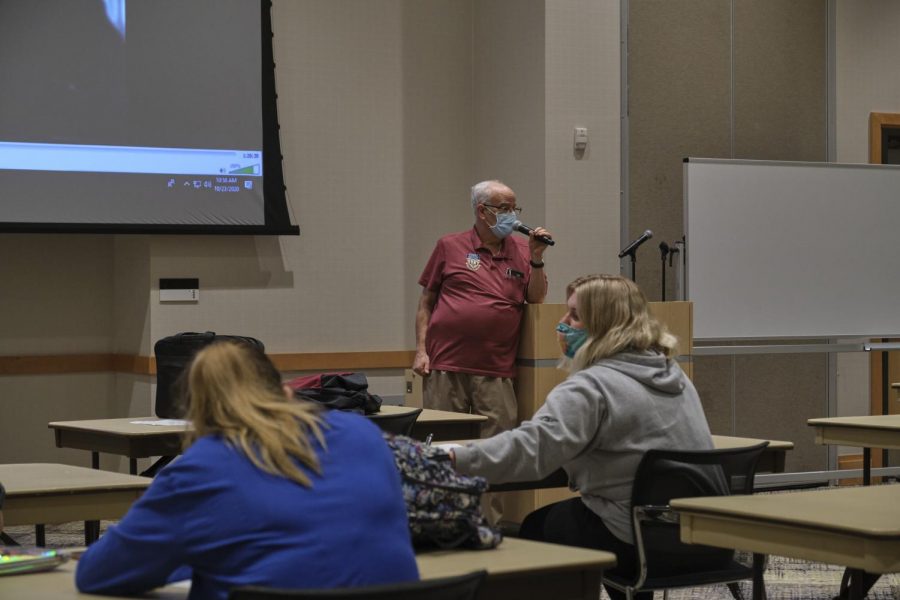 Professor Philip Resnick talks to students before class starts.