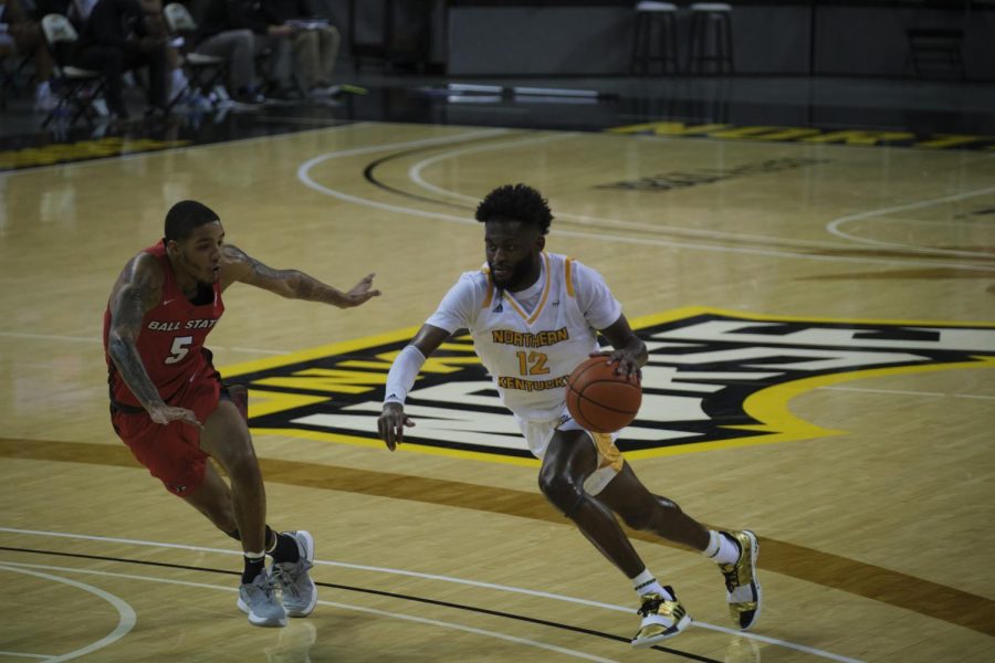 Trevon Faulkner (12) drives past a Ball State defender. Faulkner would finish with 17 points.