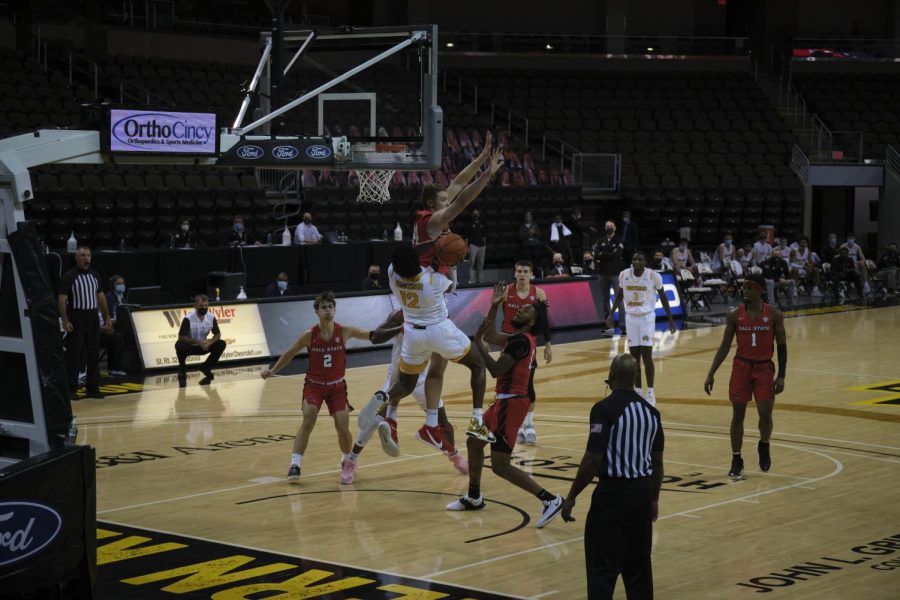 Trevon Faulkner (12) makes contact with a Ball State defender as he goes up for a layup.