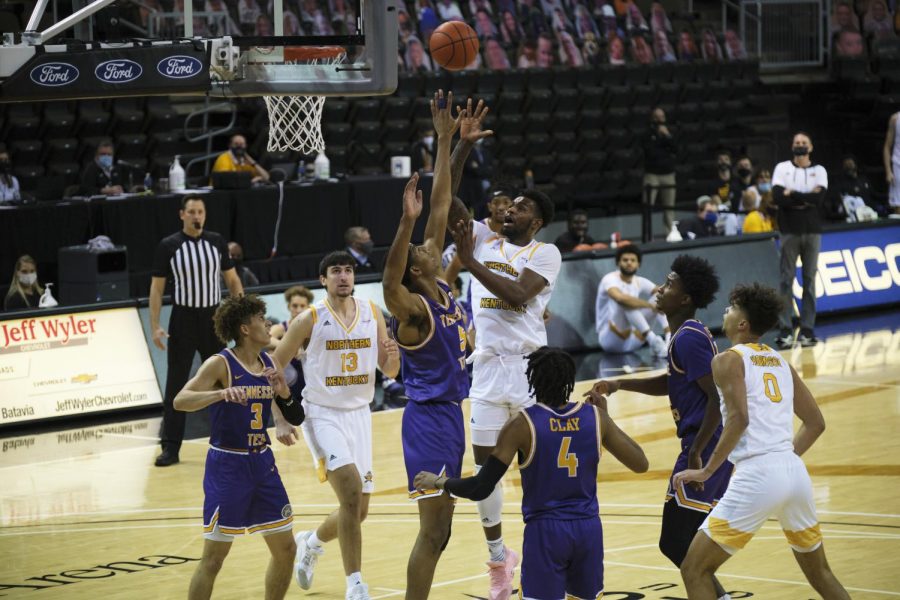 Adrian Nelson (4) shoots over a Tennessee Tech defender. Nelson finished with 10 points and 14 rebounds.