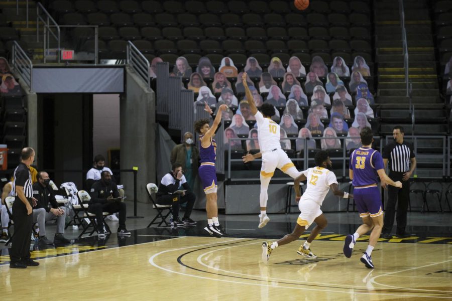 John Harge (10) defends a Tennessee Tech three-point attempt.