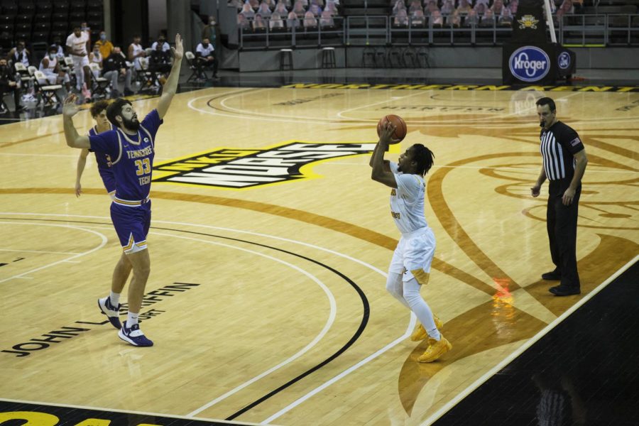 Guard Bryson Langdon draws a Tennessee Tech defender in the air with a pump-fake. 