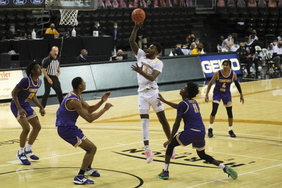 Adrian Nelson (4) shoots a jumper in the lane against Tennessee Tech.