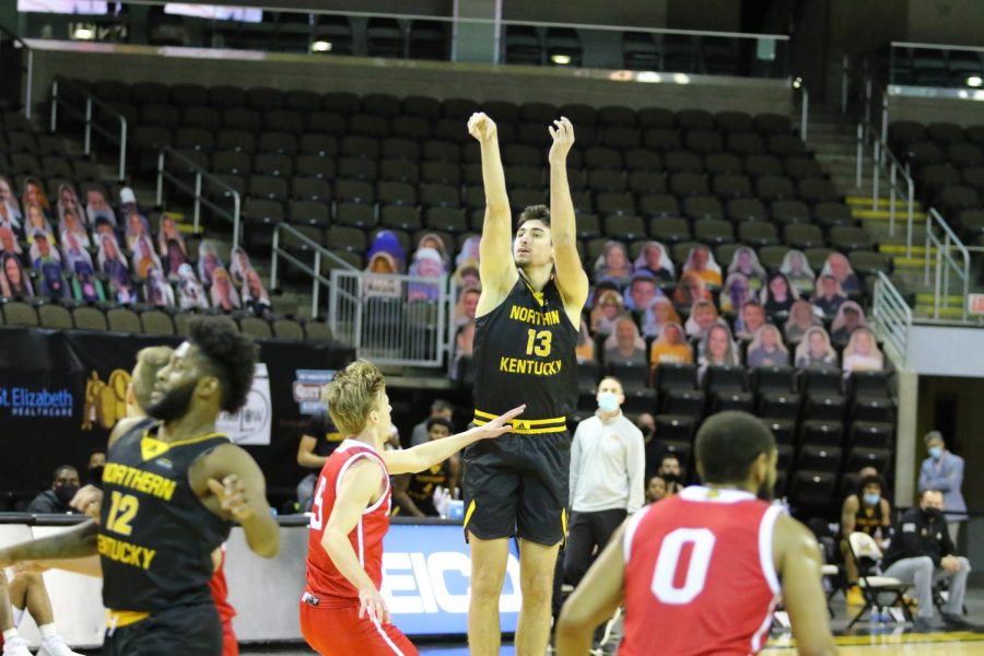 David Böhm (13) attempts a jumper against IUPUI. 