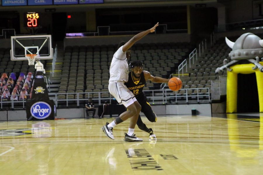 Trevon Faulkner (12) drives past a Purdue Fort Wayne defender. The Norse would defeat the Mastodons 70-68.