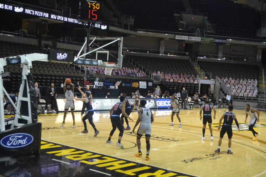 NKU guard Trevon Faulkner attempts a shot against UIC. Faulkner finished the night with 25 points. 