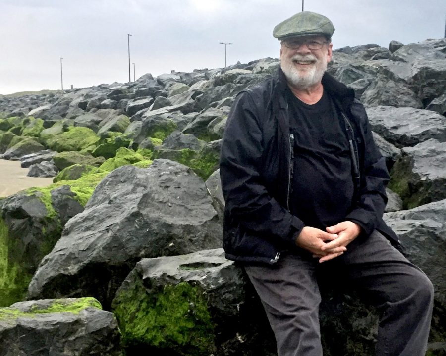 Stephen Leigh sitting on rocks in Ireland.