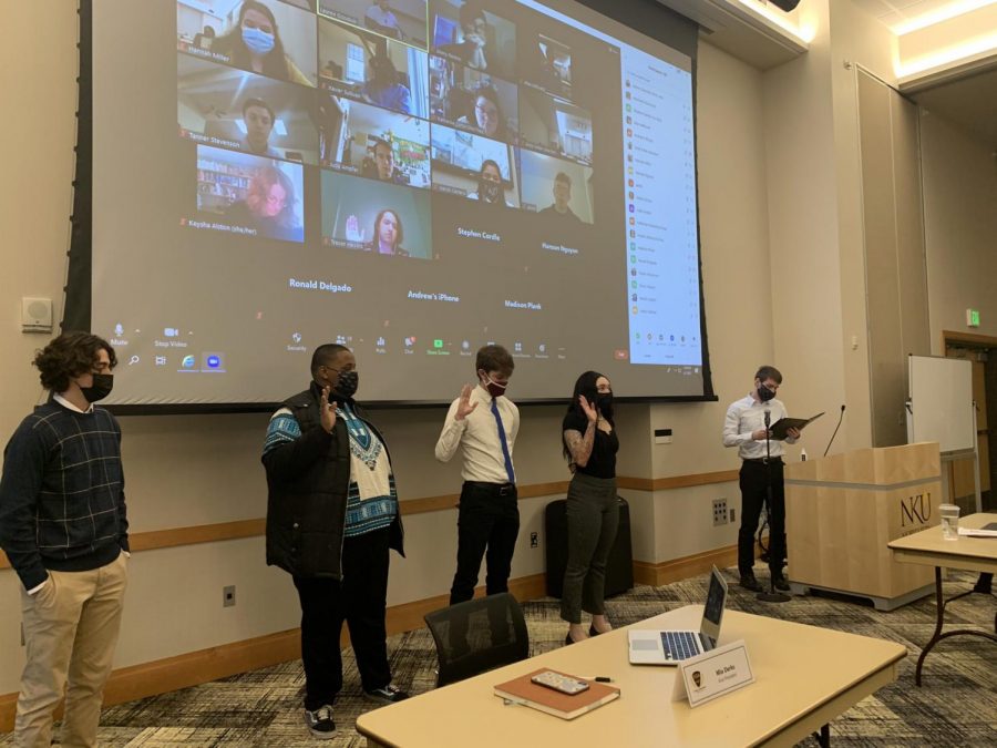 SGA Senator Mohamed Omar (second to the left) being sworn into office. 