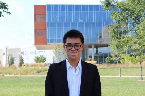 Hanson Nguyen wearing a dress shirt looking at the camera. 