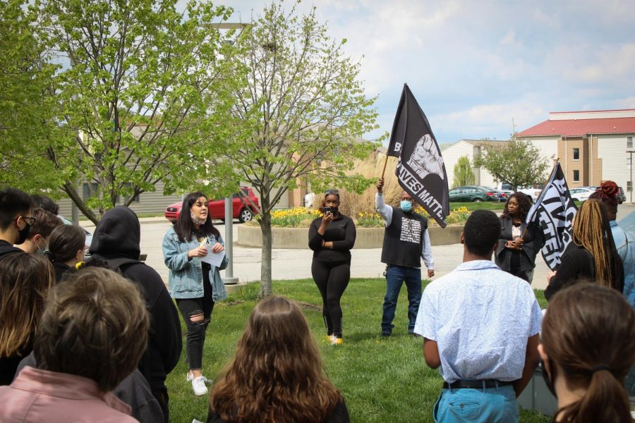 SGA Student Rights and Advocacy Chairwoman Karla Arango speaks in front of the crowd by Norse Commons.