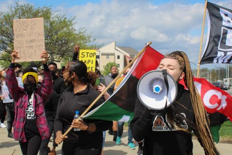 SGA President-elect Aliya Cannon leads the march to Lucas Administration Center.