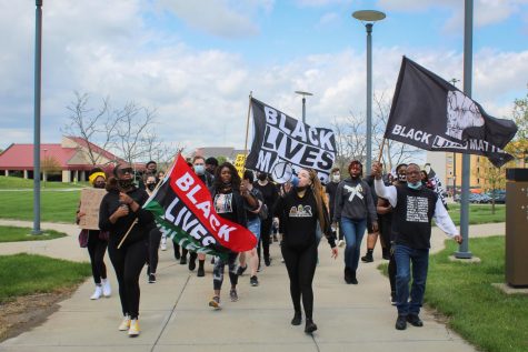 SGA President-elect Aliya Cannon leads the march to Lucas Administration Center.