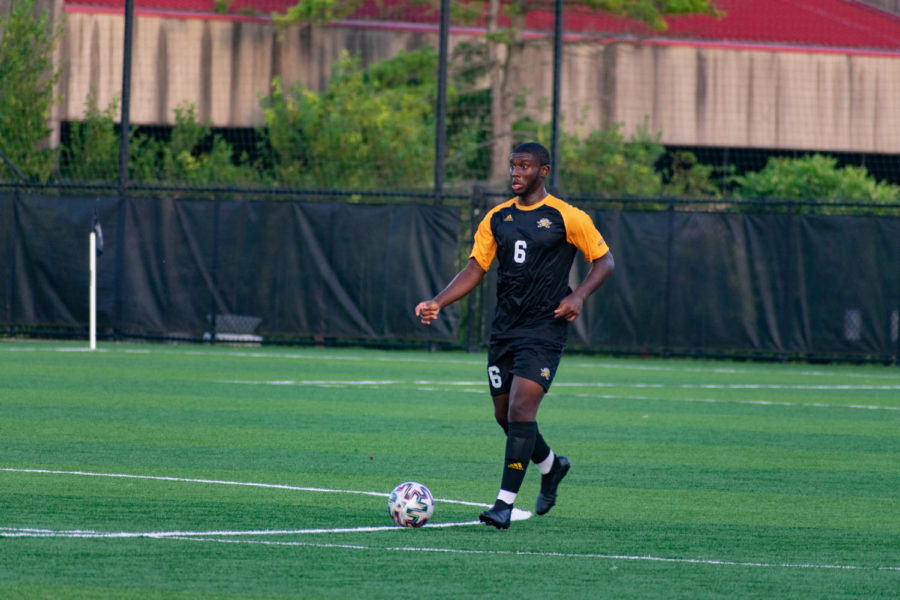 NKU defender Samuel Nwosu (6) dribbles the ball during NKU's 3-0 win over Centre College on Saturday. 