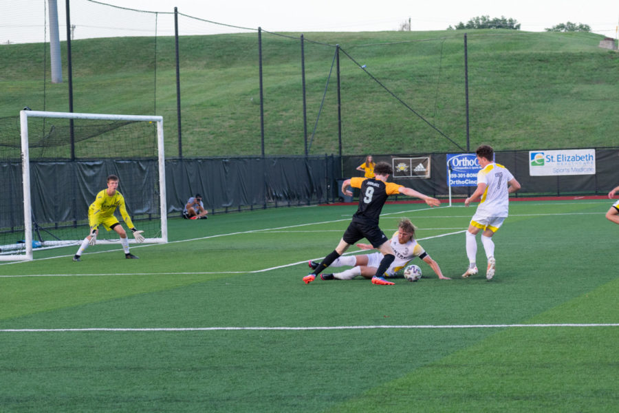 NKU forward Jesse Randall (9) dribbles the ball near the box during NKU's win over Centre on Saturday. 