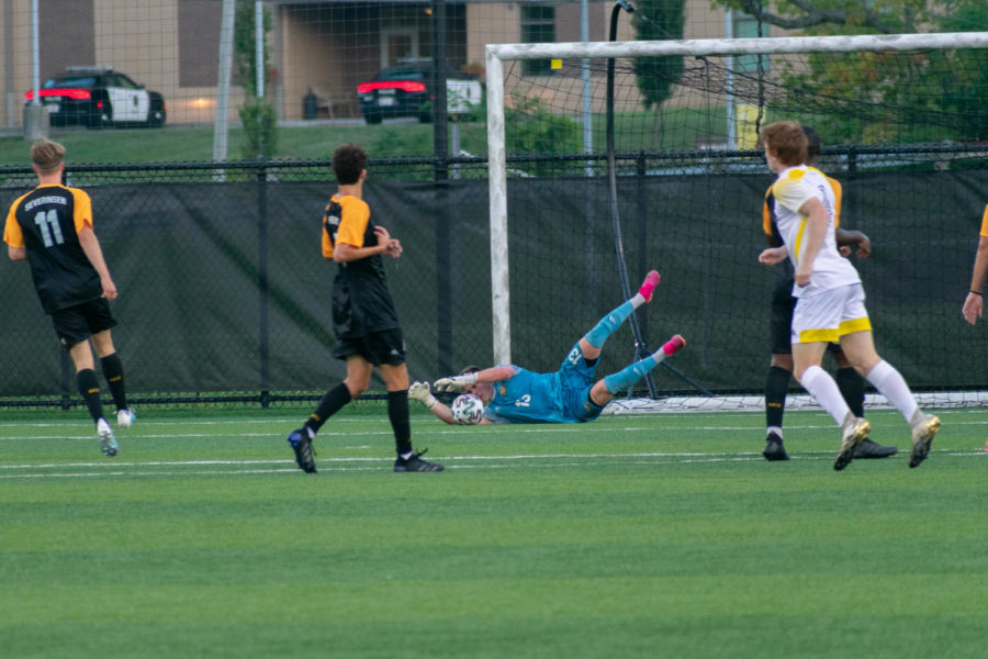 NKU goalkeeper Daniel Bermingham (13) makes a diving save during the Norse 3-0 win over Centre on Saturday. 