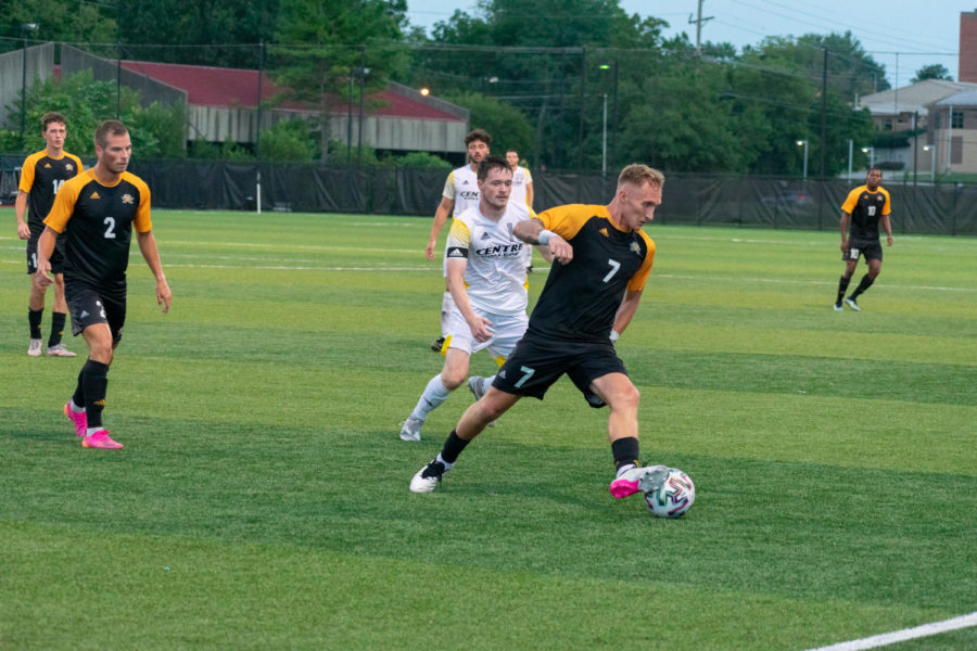 NKU forward Dylan Bufton (7) dribbles the ball through the defense during NKUs win against Centre on Saturday.