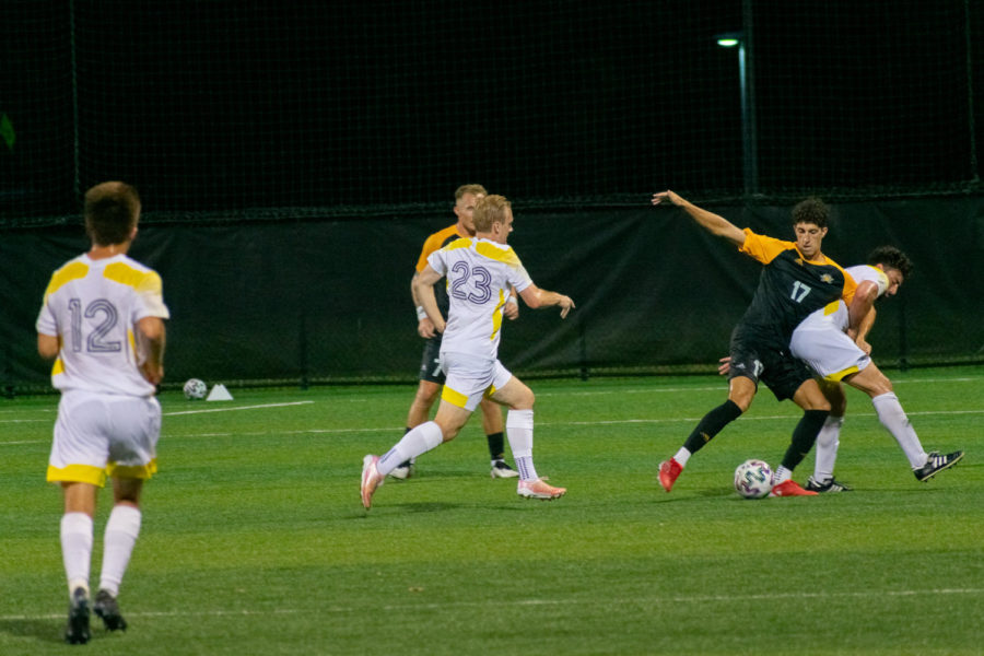 NKU forward Sam Robinson (17) dribbles through contact from a Centre defender. Robinson scored a goal during NKU's win over the Colonels.