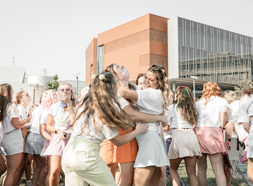 A group of girls in one of NKUs sororities embrace one another on Sunday during Bid Day festivities.
