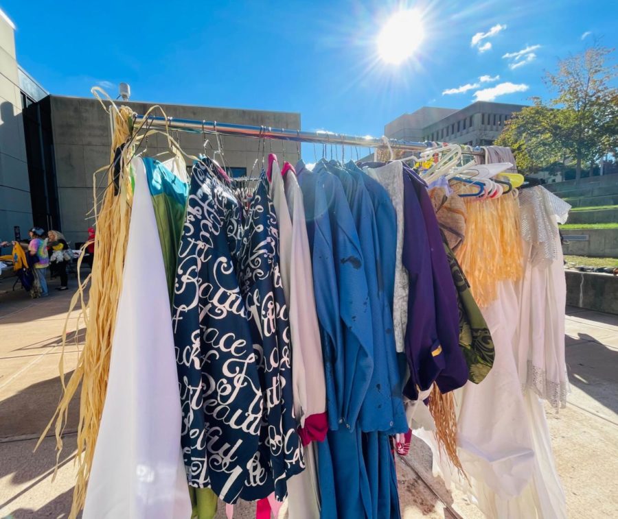 A rack full of costumes for sale.