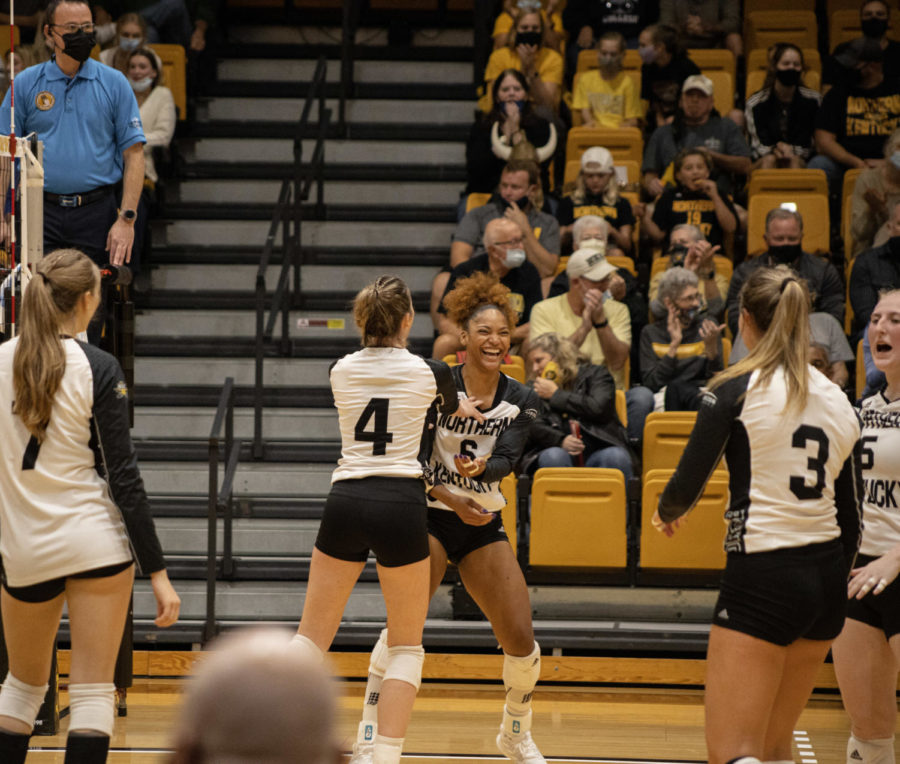 Members of the NKU volleyball team celebrate a point during the 3-1 win over Oakland on Friday.